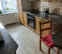 Kitchen with wooden cabinets stove