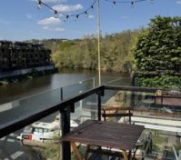 Balcony river view string lights