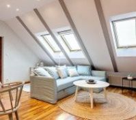 Bright attic living room with skylights