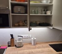 Kitchen cabinets with dishes stored