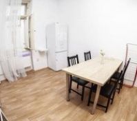 Dining area with table and fridge