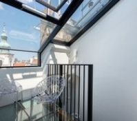 Bright glass balcony with city view