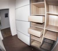 Built-in wardrobe with open drawers