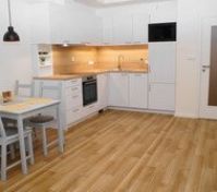 Modern white kitchen with dining