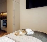 Bedroom with kitchenette and TV