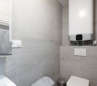 Bathroom with toilet and water heater