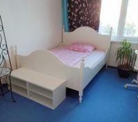 Bedroom with white bed and plant