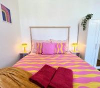 Bed closeup with wardrobe mirror