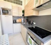 Kitchen with appliances and hob