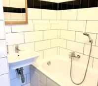Bathroom with tub and sink