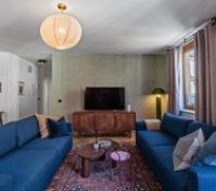 Living room two blue sofas TV