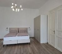 Bright bedroom with double bed wardrobe