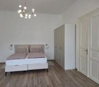 Bright bedroom with double bed wardrobe