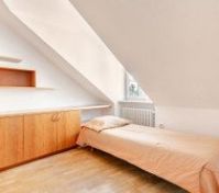 couch under the windows sleeps additional 1 person. pillow, cover and additional bedding is available in the cabinet