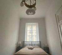 bedroom with 3 beds (singl and double)