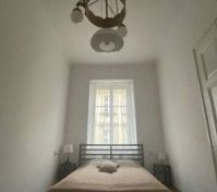 bedroom with 3 beds (singl and double)
