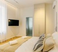 Bedroom with TV and wardrobe