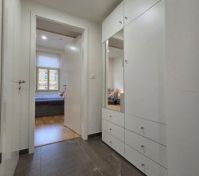 Hallway with wardrobe leading to bedroom