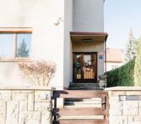 House entrance with wooden gate