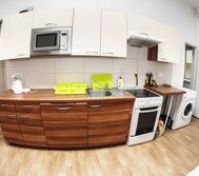 Kitchen with wooden cabinets and appliances