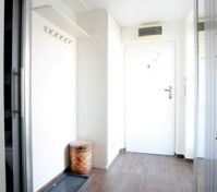 View - entrance door, entrance to the bathroom on the left, entrance to the terrace on the right