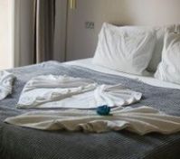 Double bed with decorative towels