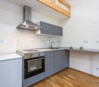 Gray kitchen with oven and loft