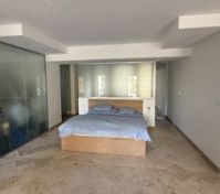 Bedroom with glass partition wall