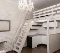 Open kitchen with loft staircase