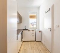 Kitchen overview with entrance door