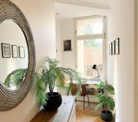 Hallway with mirror and workspace