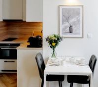 Kitchen and dining area with flowers