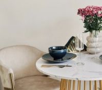 Marble dining table with gold chairs