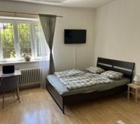 Bedroom with double bed and TV