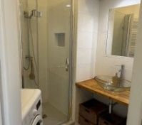 The bathroom with a shower