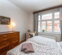 Bedroom with dresser and window
