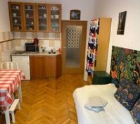 Kitchen with dining and bed area