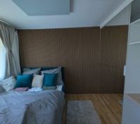 Bedroom with wood slat accent wall