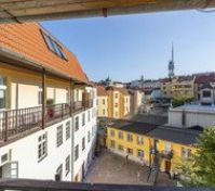 Balcony view over city rooftops