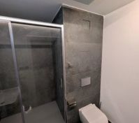 Bathroom shower and wall-hung toilet