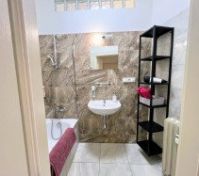 Bathroom doorway with tub sink