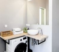 Bathroom with sink and washing machine