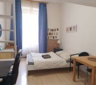 Here it is!  A small private apartment in the middle of everything.  Cool neighborhood with loads of local restaurants, shops, groceries and more.  Easy walk to the main train station.  Access many trams and all three metros easily.  
