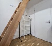Wooden loft ladder with clothing rack
