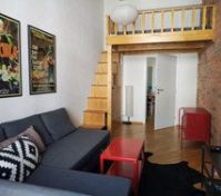 Living room with sleeping loft