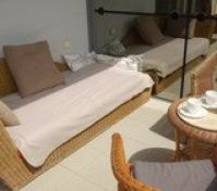 and a rattan sofa.