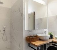 Marble bathroom with shower and washer