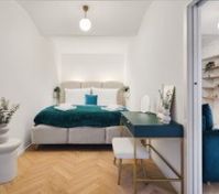 Bedroom with desk and herringbone floor
