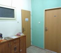 The toilet is located in the hallway, in a separate room from the shower.  The hallway is an information area with maps, tip book and wifi.  NOTE: the apartment across the hallway has their entrance opposite to yours. 