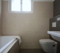 Full bathroom with bathtub and toilet